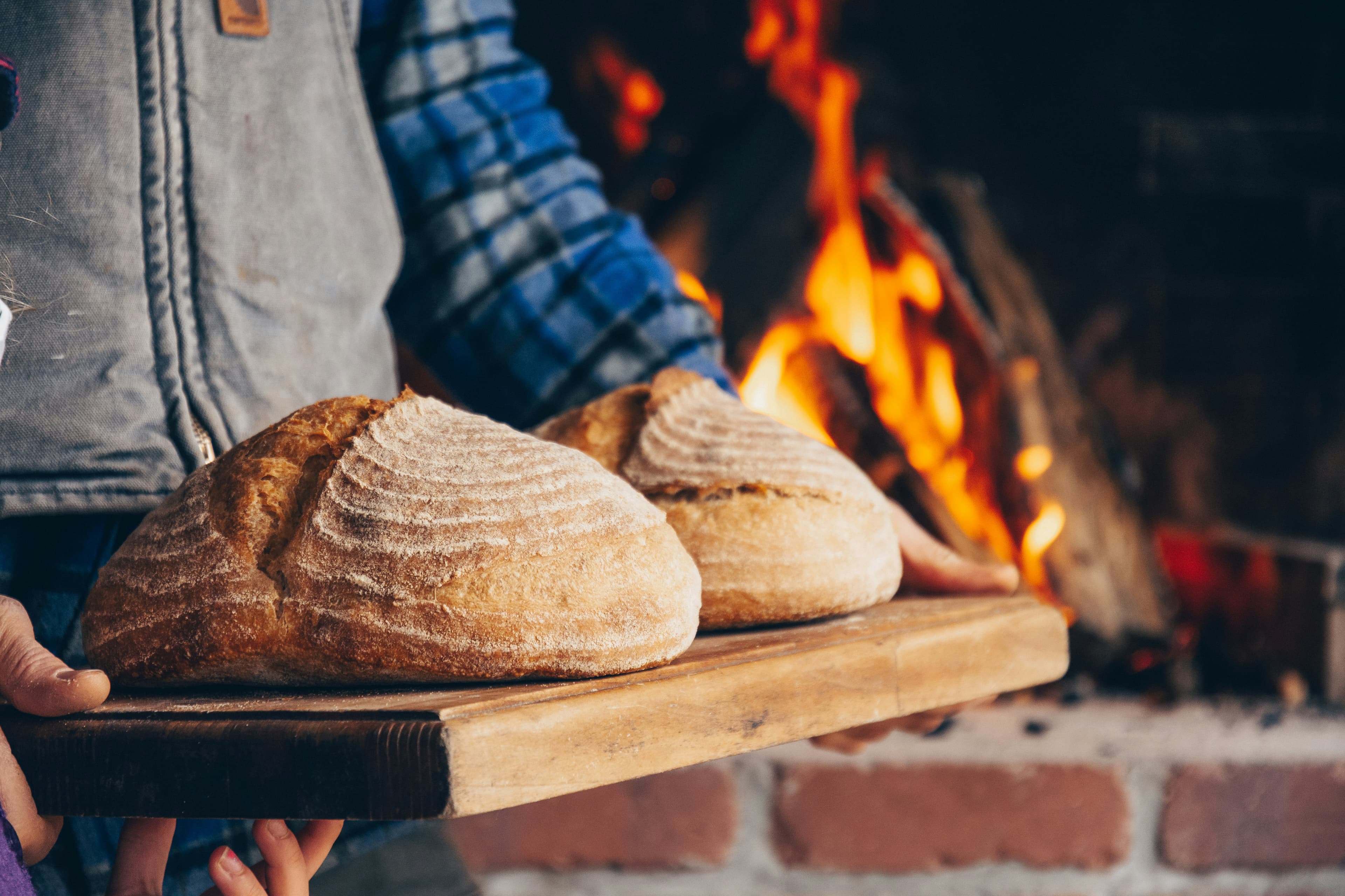 Artisan baker preparing sourdough loaves